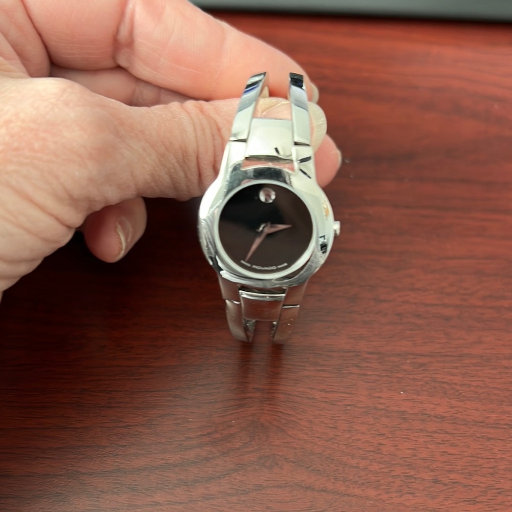 Movado watch - used - needs a battery - no scratches on the face of the glass